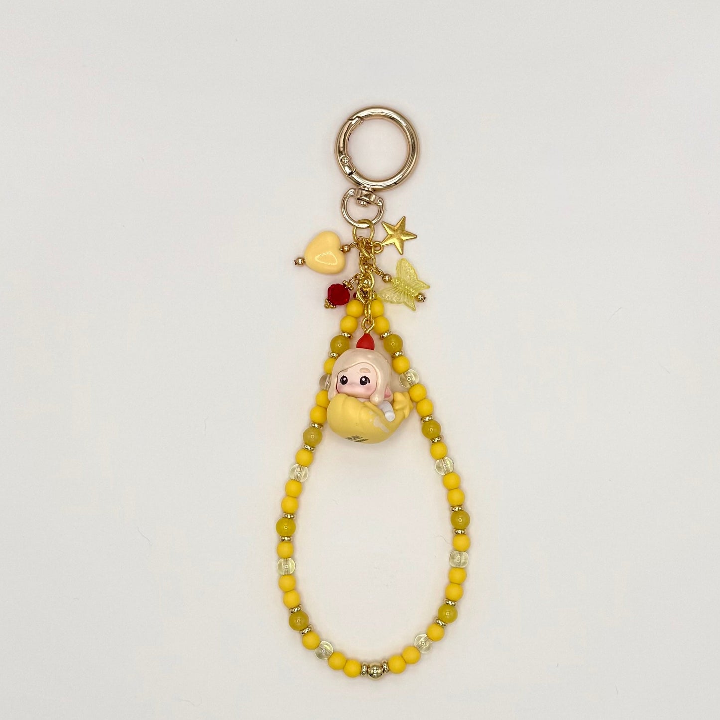 Keychain with cartoon character charm on a white background