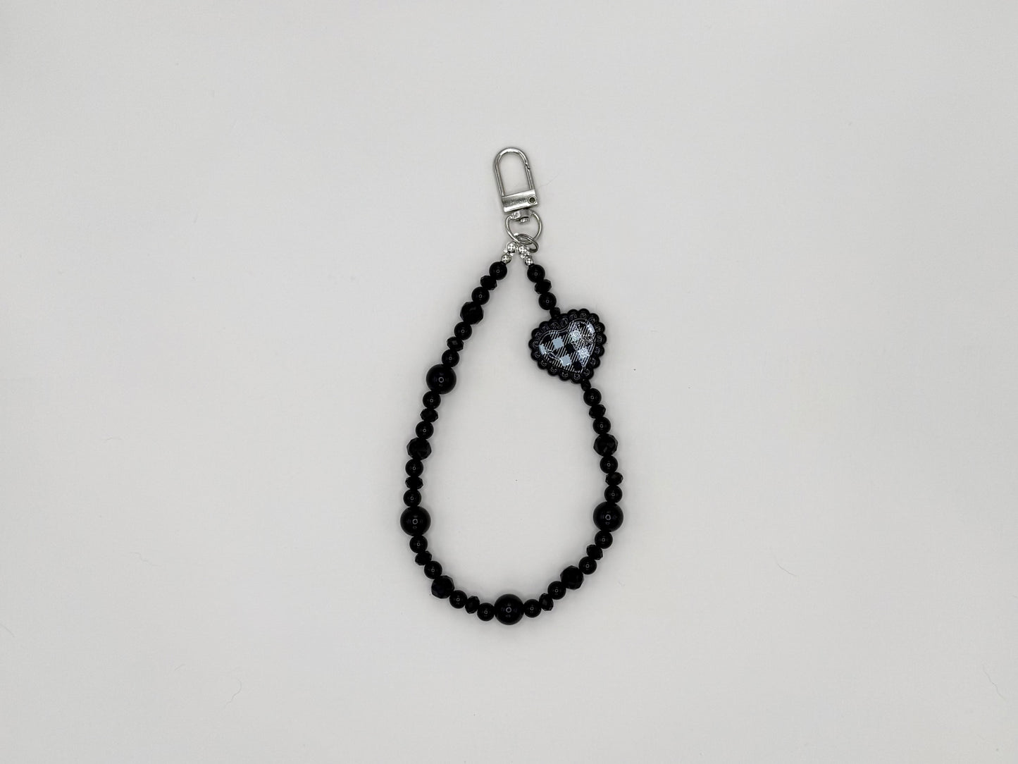 Black beaded keychain wrist strap with gingham heart charm and silver swivel clip